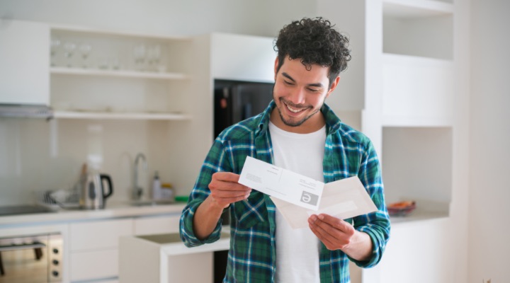 man looking at insurance paperwork